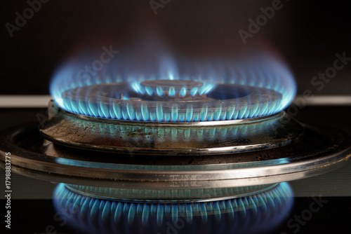 Gas stove is turned on. Closeup view of burning flame