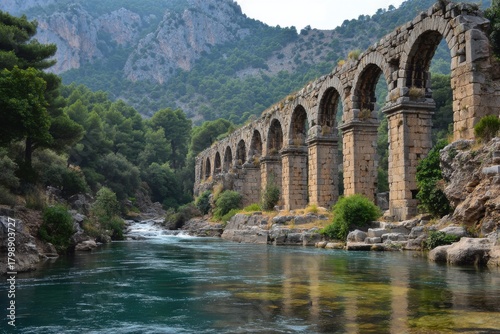 Fototapeta Naklejka Na Ścianę i Meble -  Exploring the stunning Olbaroman Aqueduct Arches surrounded by lush nature near Uzuncaburc in the heart of Turkey