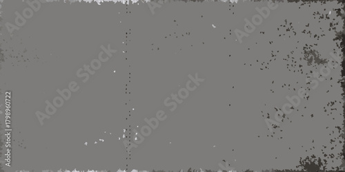 Grungy textured background with distressed edges and scattered speckles in shades of gray