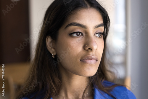 Wallpaper Mural Thoughtful serious young Indian woman facial portrait Torontodigital.ca