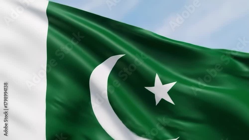 Waving pakistan national flag with crescent moon and star in the wind