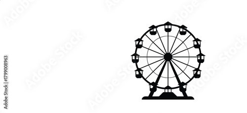 Silhouette of a large ferris wheel at an amusement park