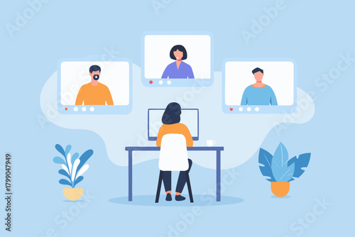 Woman participating in a video conference call with colleagues from home office setting