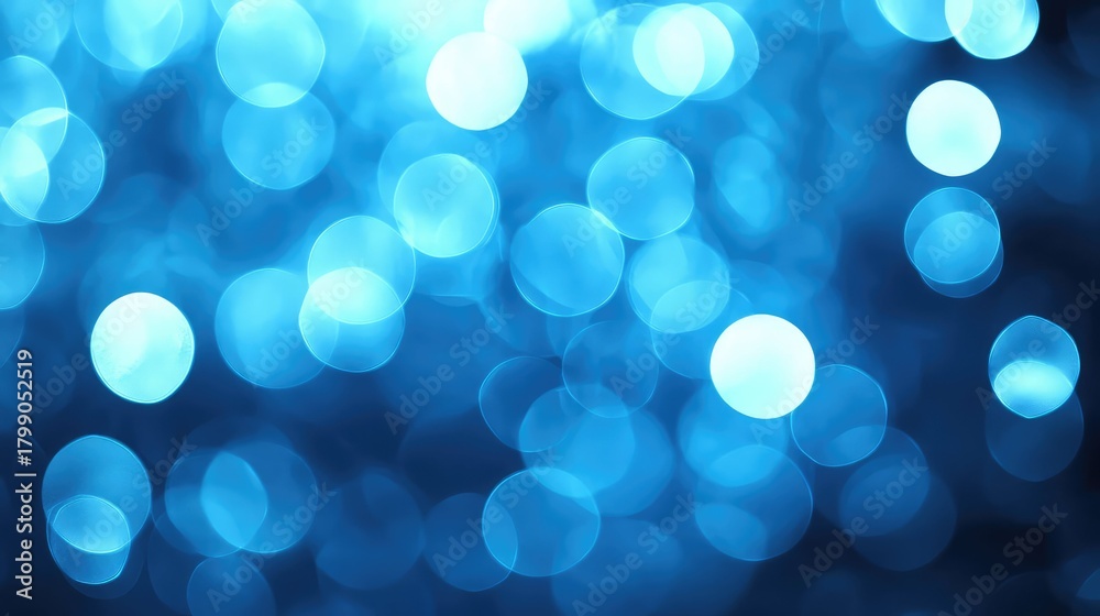 Fototapeta premium Blue bokeh lights creating an abstract festive background