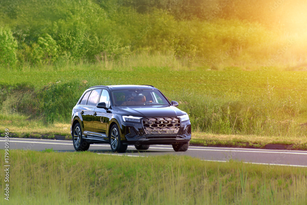 Fototapeta premium Family trip in a fast sport utility vehicle