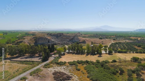 Balat, Turkey. Aerial drone view of the ancient Theatre of Miletus and Ilyas Bey Kervansarayi, archaeological site in Turkey. Aerial View