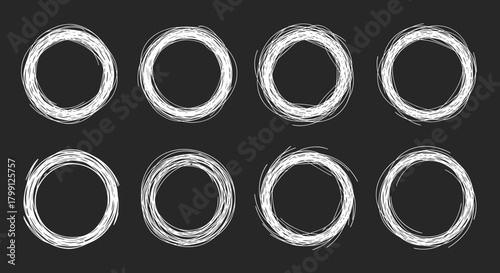 Eight hand-drawn white chalk circles on a dark background, forming two rows of four.