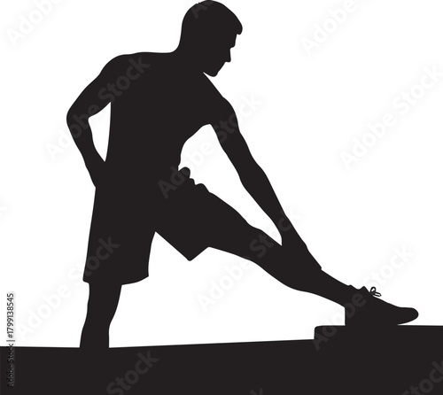 Silhouette of a man stretching his leg on a raised surface for fitness and exercise