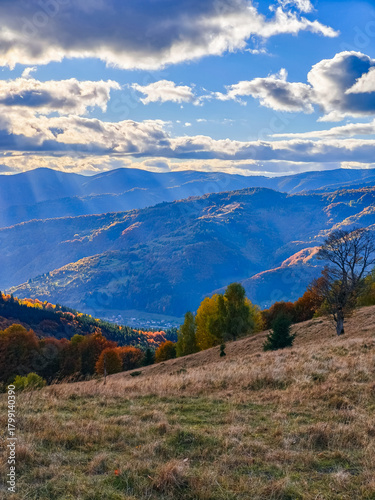 Sun shines through the clouds in the mountains