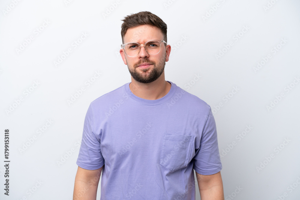 Fototapeta premium Young caucasian man isolated on white background with sad expression