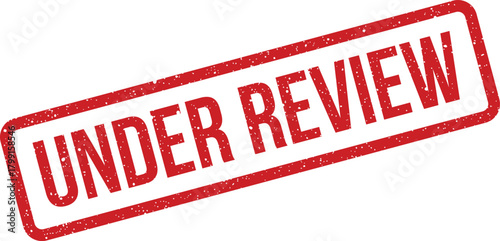 Distressed red rubber stamp displaying an under review notice for approval processes or documents