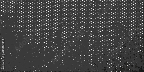 Abstract dark background with a dense pattern of small white dots fading into darkness