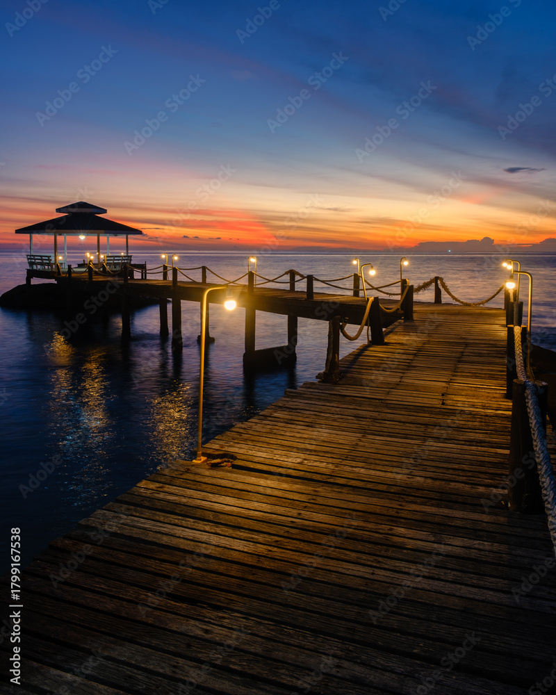 Fototapeta premium Stunning sunset view from a wooden pier on Koh Kood Island Thailand