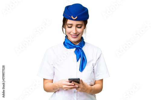 Foto Airplane stewardess over isolated chroma key background sending a message with t