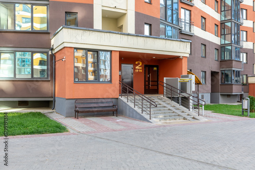 Accessible Entrance to Modern Residential Building with Ramp and Lift