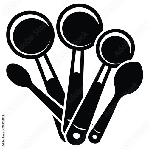 Four black kitchen spoons are layered, showing different sizes and shapes clearly