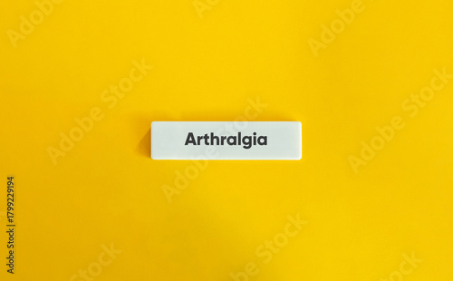 Foto Arthralgia Banner on White Tile Over Yellow Background