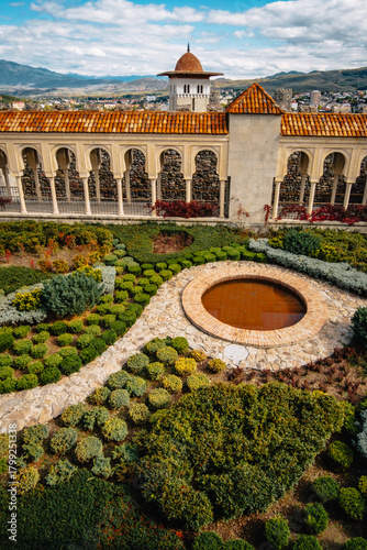 view of the beautiful garden and the gallery inside of akhaltsikhe (also called rabati) castle complex in georgia