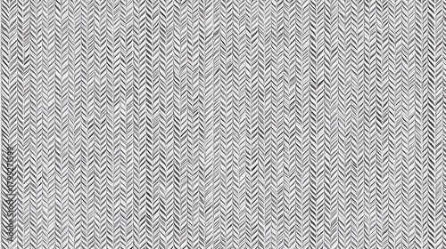 Detailed gray herringbone pattern forms a subtle textured background.
