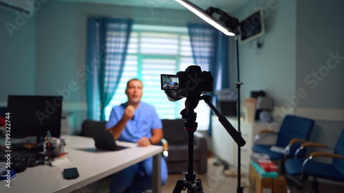 Doctor's office with camera on tripod and light equipment. Medical blog content recording. Selective focus.