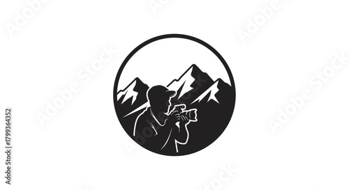 A black and white circular logo featuring a photographer in front of mountain peaks, capturing the landscape.