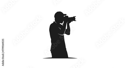Silhouette of a photographer wearing a cap, holding a camera and taking a picture.