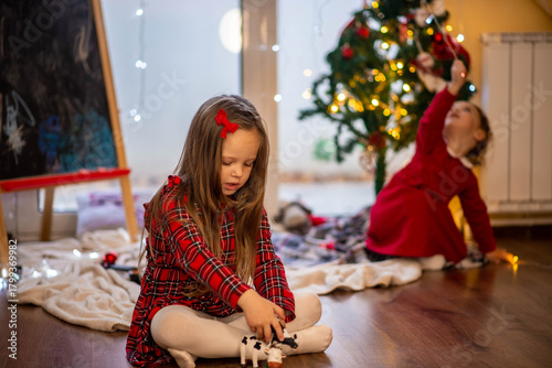 little girl with christmas tree