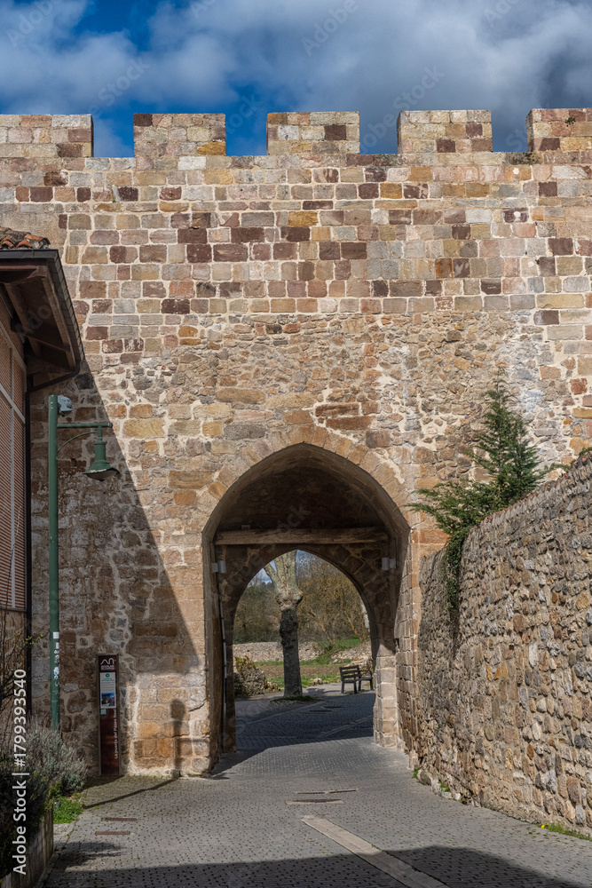 Naklejka premium Royal Walk Gate Historic Stone Arch Aguilar de Campoo