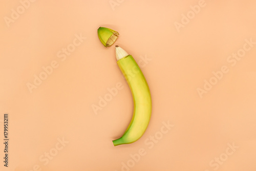 Concept of male circumcision, banana with the tip of the peel cut off