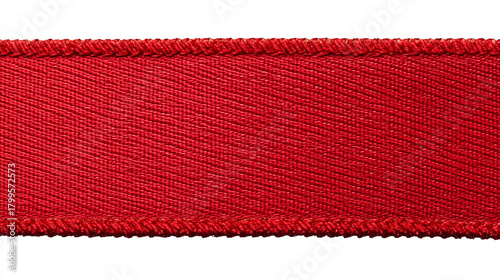 A close up of a red fabric ribbon with a textured surface and stitched edges on a white background
