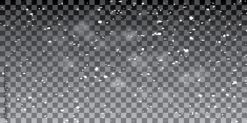Transparent background with small falling snowflakes.