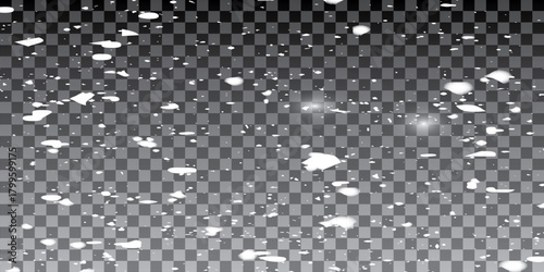 Transparent background with small falling snowflakes.