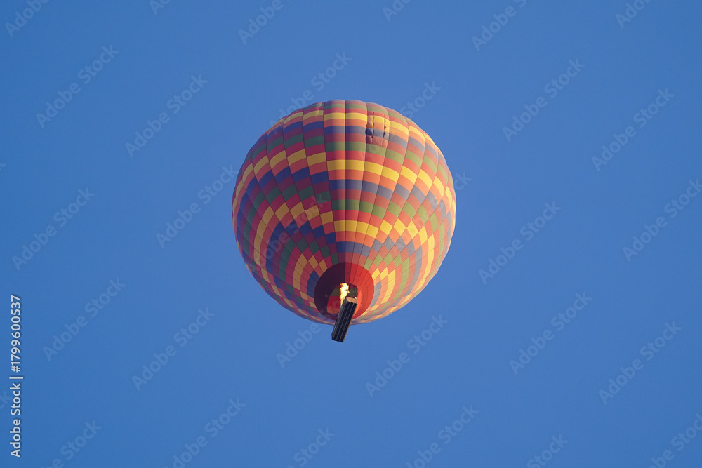 Fototapeta premium Hot Air Balloon over Cappadocia Valleys in Nevsehir, Turkiye