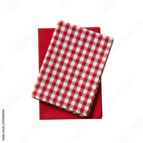 Two red fabric napkins one solid red and one red and gingham pattern checkered