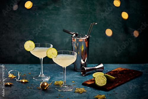 Classic Lime Cocktails with Shaker and Fresh Citrus on Festive Table