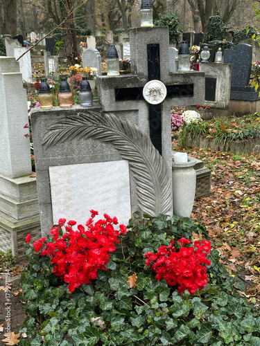 Stone cross on the tombstone in the public cemetery