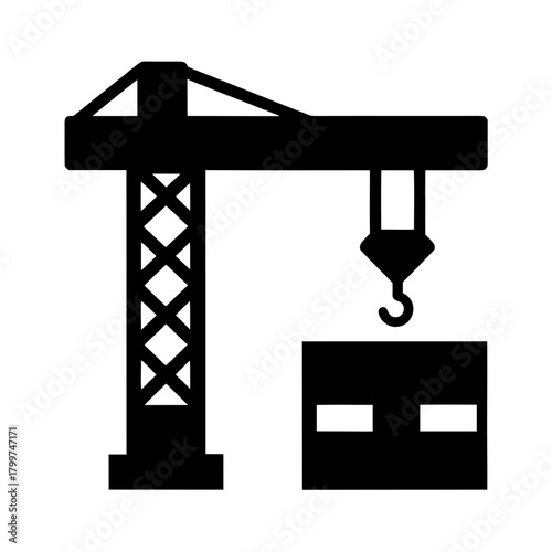 Silhouette of a construction crane lifting a heavy object