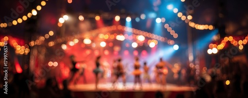 A circus stage with a group of performers on it