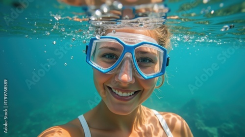 Fototapeta Naklejka Na Ścianę i Meble -  Underwater selfie smiling woman swim goggles snorkeling clear water coral reef tropical sea summer vacation marine life adventure 
