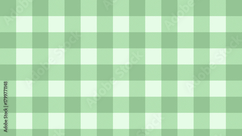 A green plaid pattern. Green squared tablecloth background.