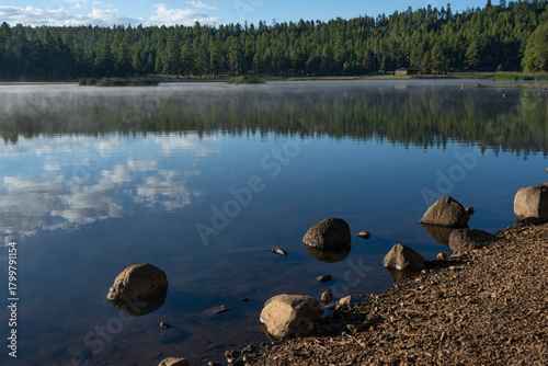 A peaceful mountain lake in the morning light