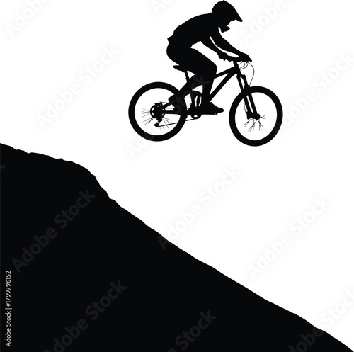 Silhouette of a mountain biker jumping off a steep hill against a white background