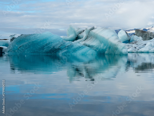Blue icebergs floating in Iceland's Jokulsarlon Glacier Lagoon in early morning