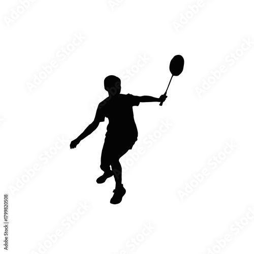 Silhouette of a badminton player in action swinging a racket during a match