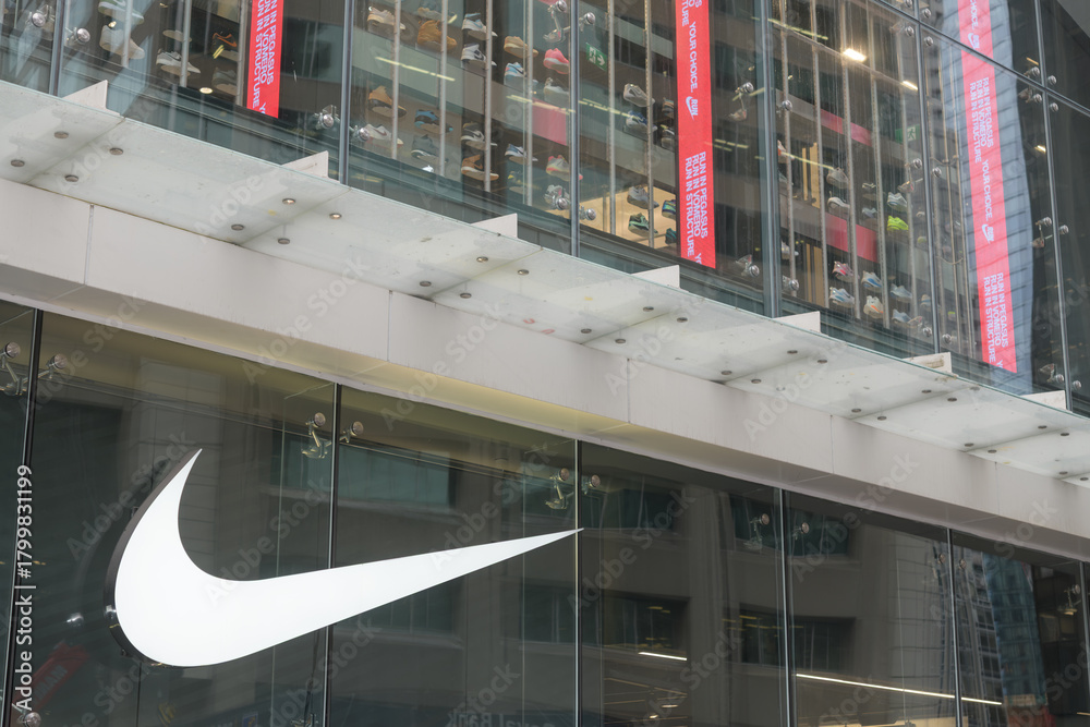 Fototapeta premium exterior building facade and sign of Nike Bloor, a sportswear store, located at 23 Bloor St E, Toronto