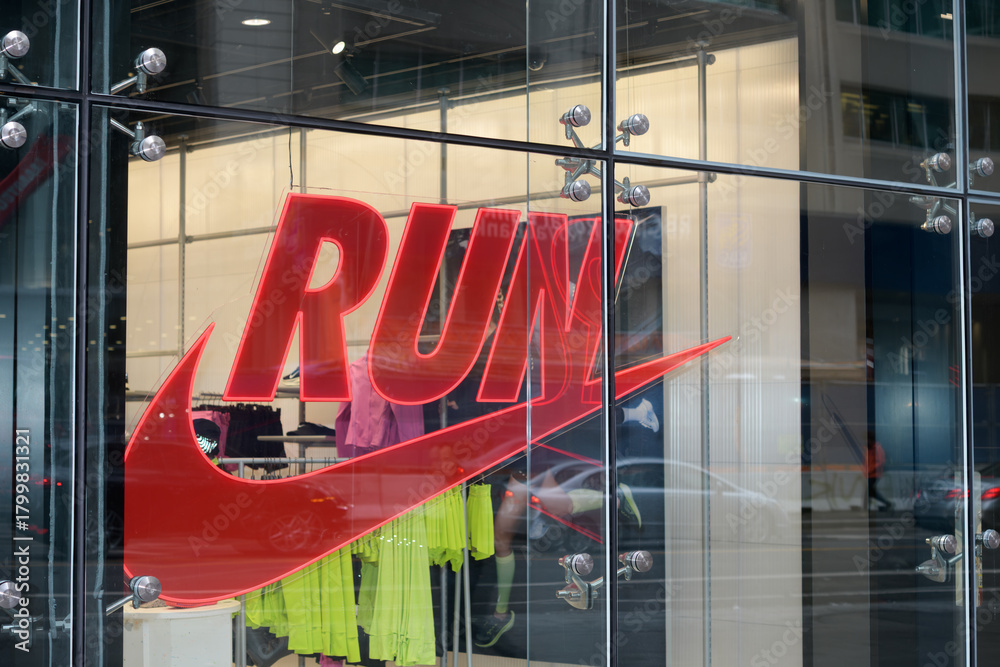 Fototapeta premium exterior building facade and sign of Nike Bloor, a sportswear store, located at 23 Bloor St E, Toronto