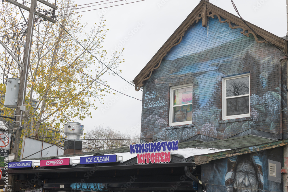 Naklejka premium exterior building facade and sign of Kensington Kitchen, a takeout restaurant, located at 255 Augusta Av, Toronto