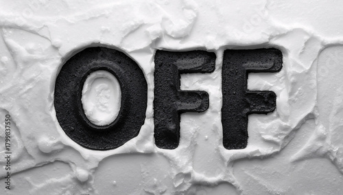 Bold off typography against a textured white background creates a statement piece