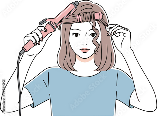 Woman curling her hair with a wand