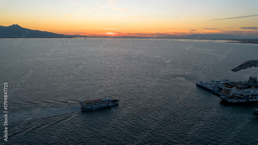 Naklejka premium Izmir - Turkey 06, November 2025, Bostanli ferry pier aerial video taken with drone